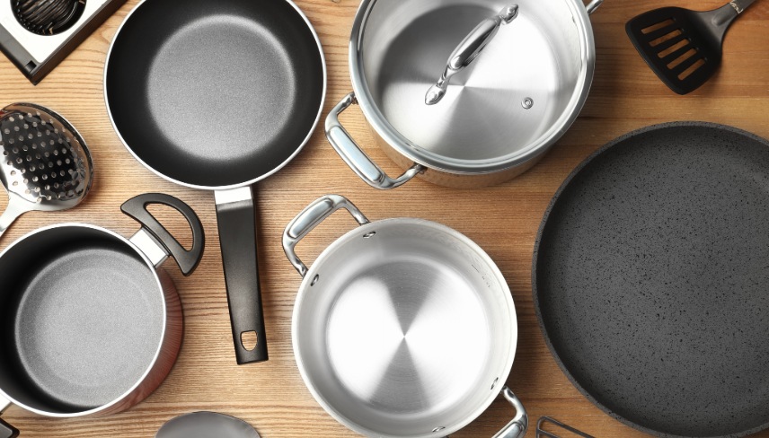 Flat lay composition with clean cookware on wooden background