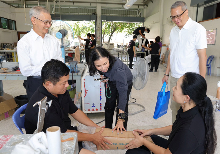 A man tries on his new prosthetic leg. 