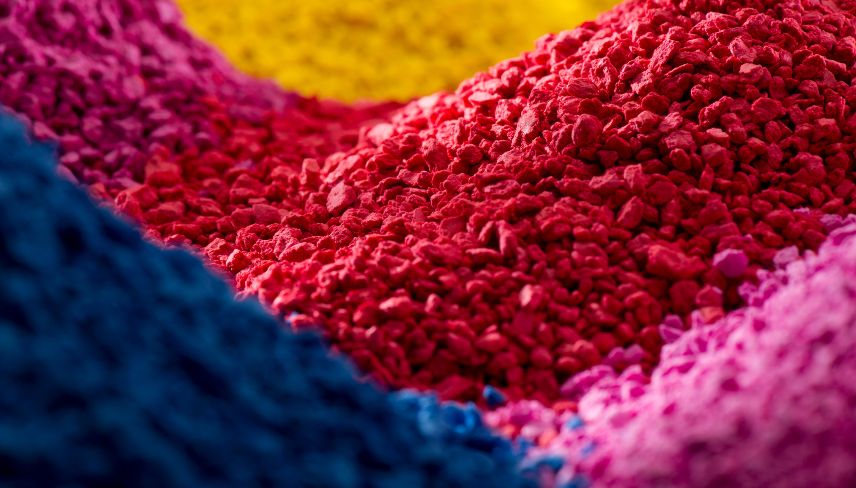 A vibrant pile of colorful powder in various hues, showcasing a spectrum of colors in a small mound.